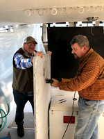 Capt. Dave and first mate Paull replacing old deck hatches.